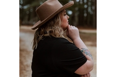 Image Woman is obese and unknowing of overweight